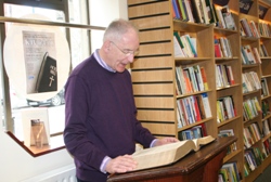 Fr Paul Symonds taking part in the KJV@4:00 project in the Good Book Shop.
